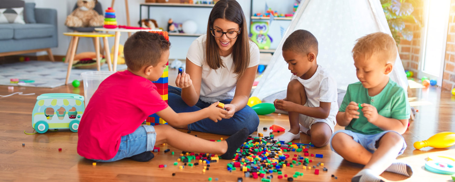 three kids with one adult playing